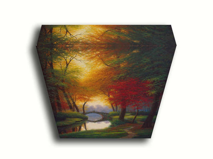 A painting of a path through a forested park in autumn, running alongside a stream to a bridge. Printed on canvas.