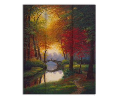 A painting of a path through a forested park in autumn, running alongside a stream to a bridge. Printed on a box board.