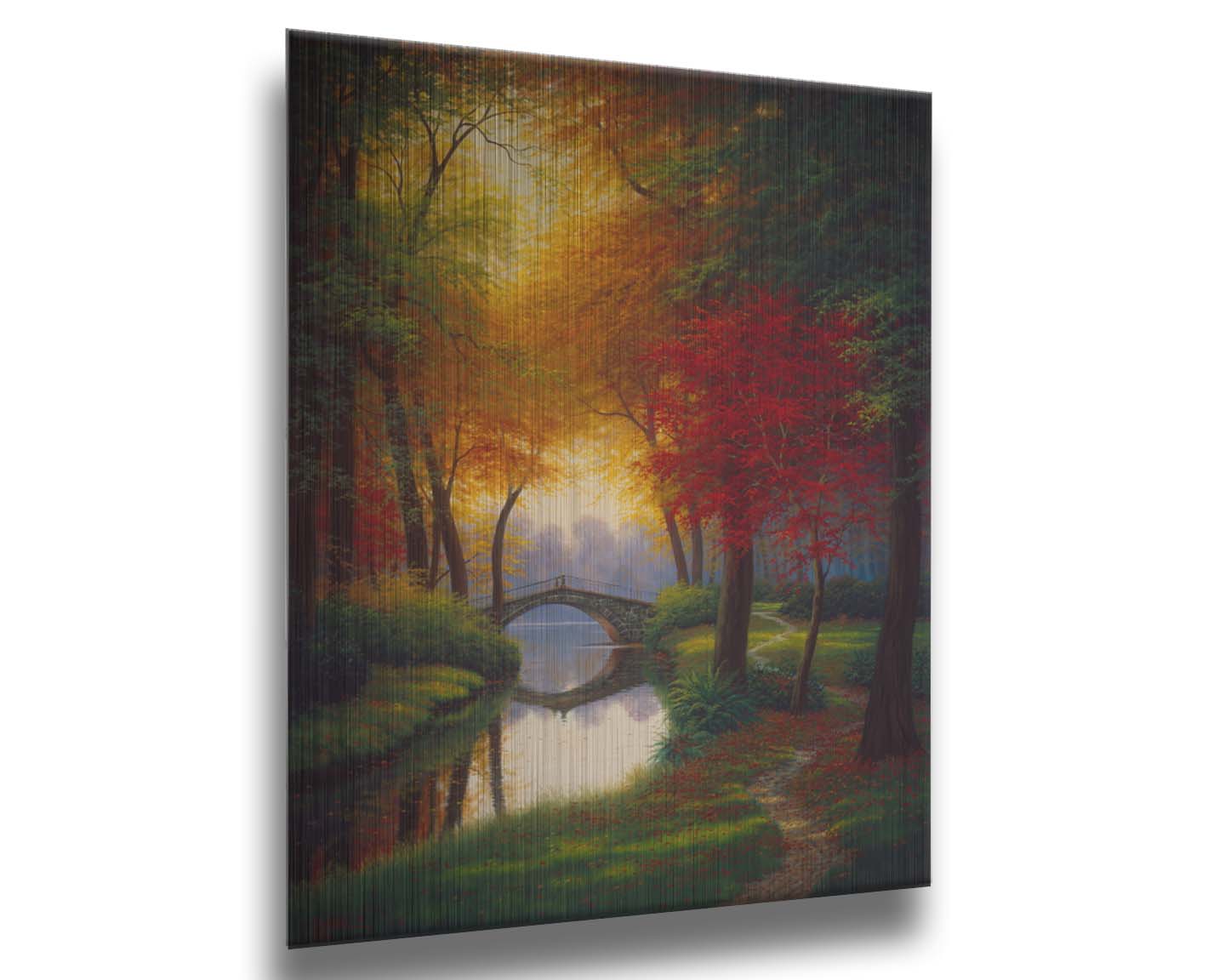 A painting of a path through a forested park in autumn, running alongside a stream to a bridge. Printed on metal.