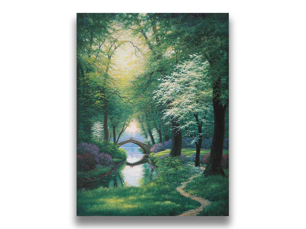 A painting of a path through a forested park in spring, running alongside a stream to a bridge. Printed on canvas.