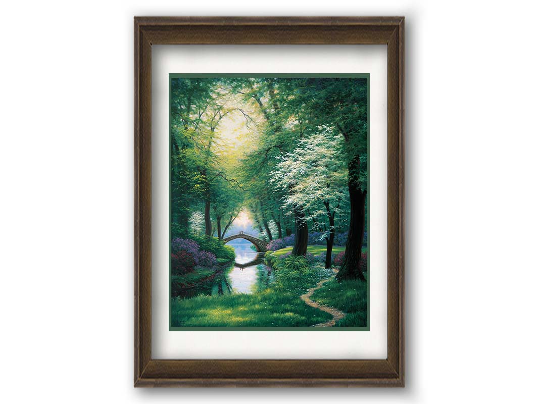 A painting of a path through a forested park in spring, running alongside a stream to a bridge. Printed on paper, matted, and framed.