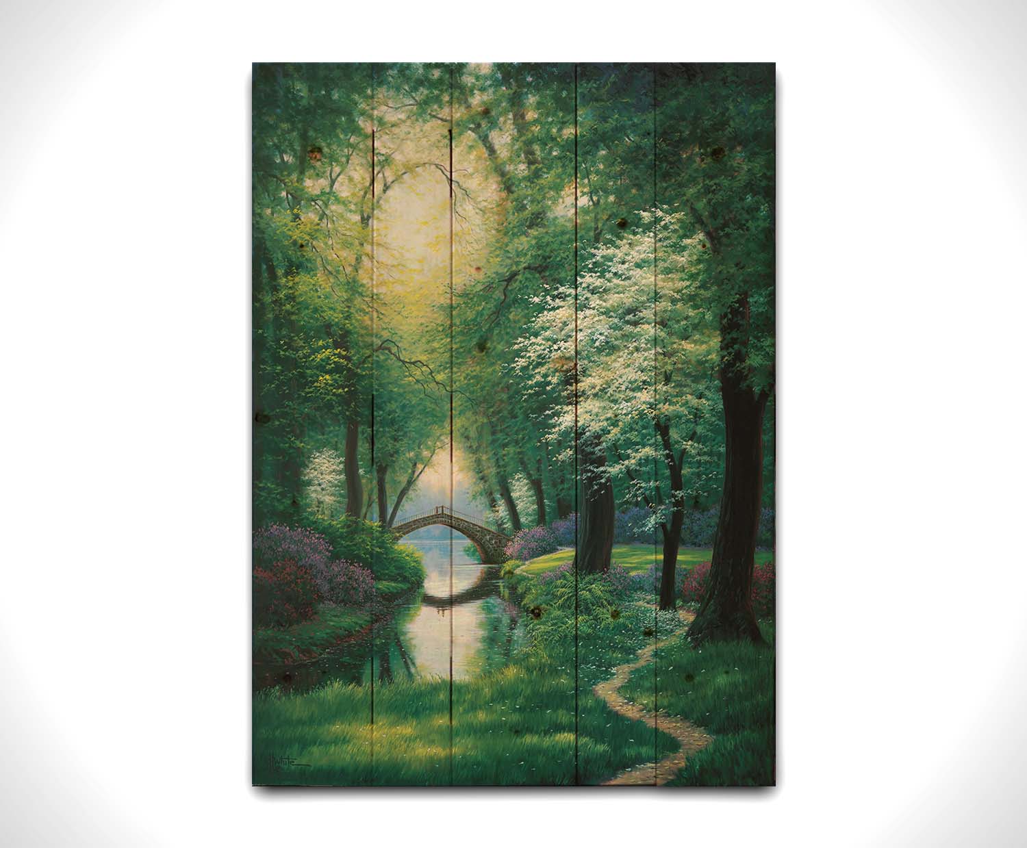 A painting of a path through a forested park in spring, running alongside a stream to a bridge. Printed on a wood pallet.