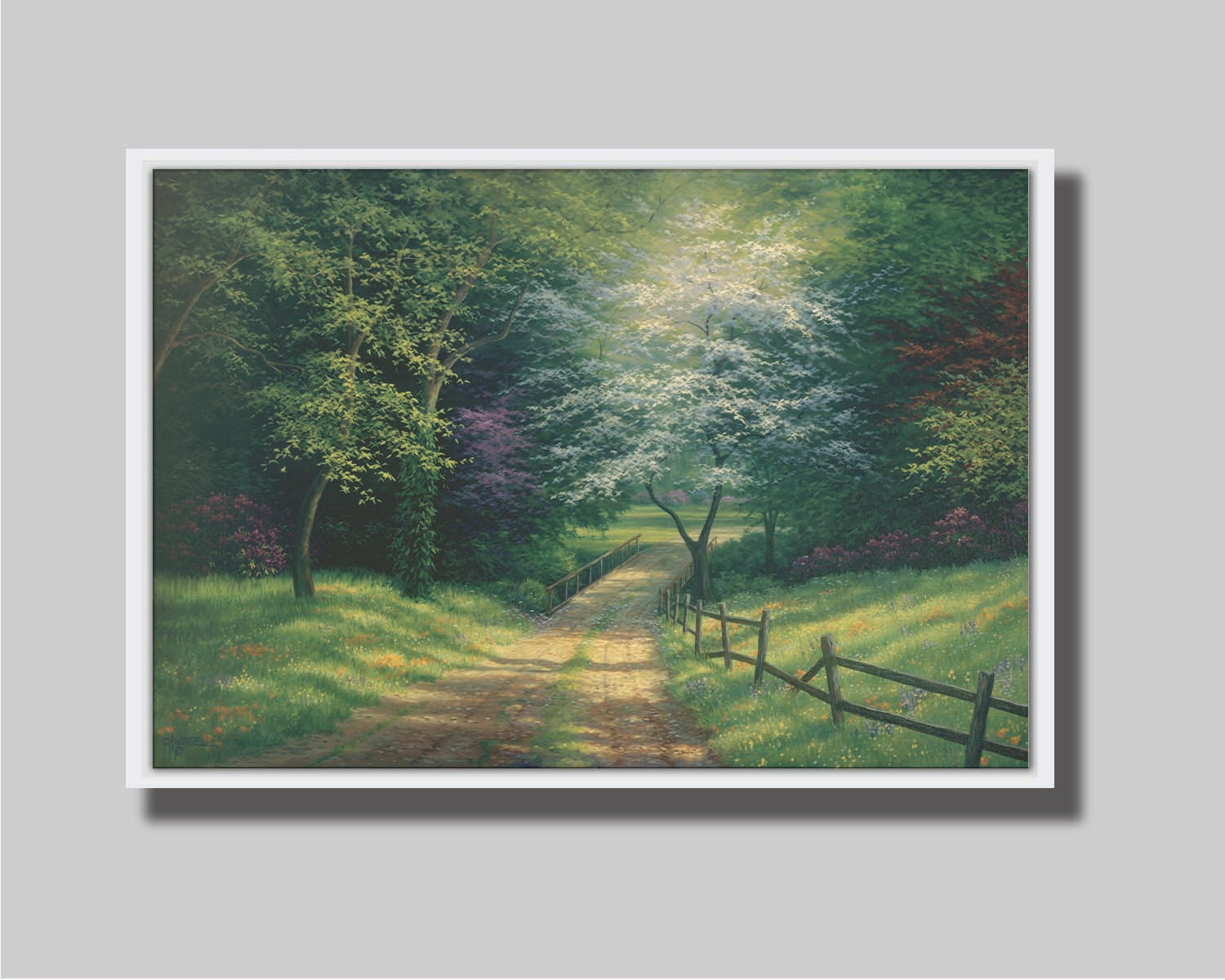 A painting of the view down a dirt road, surrounded by grass, wildflowers, and the colorful trees of spring. Light peeks through the branches, highlighting the road and connecting bridge. Printed on canvas in a float frame.