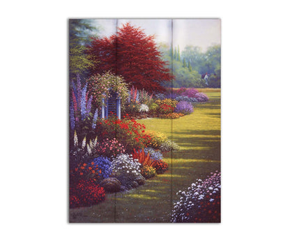 A painting of a grassy garden path, lined with blooming Buddleja and other flowers in red, pink, purple, blue, and white. Printed on a box board.