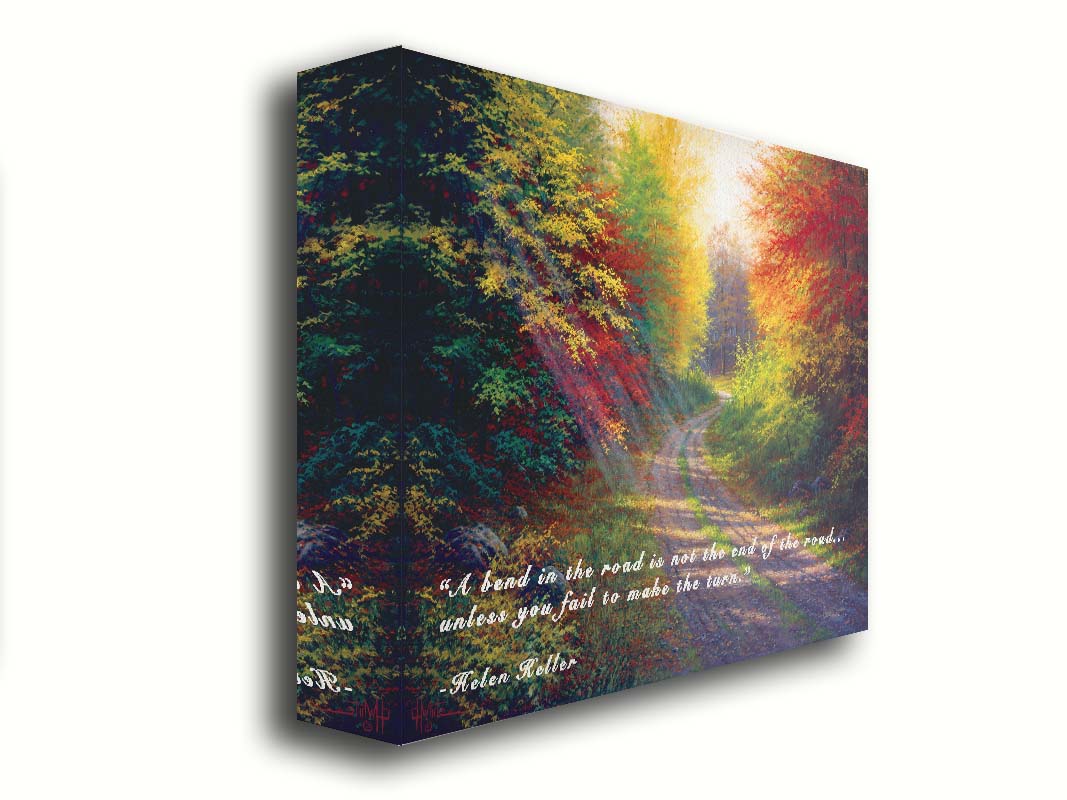 A landscape painting of a gravel road winding thorugh an autumn forest with a mix of vibrant red, yellow, and green leaves. The Helen Keller quote "A bend in the road is not the end of the road... unless you fail to make the turn" is overlaid in white across the bottom. Printed on canvas.