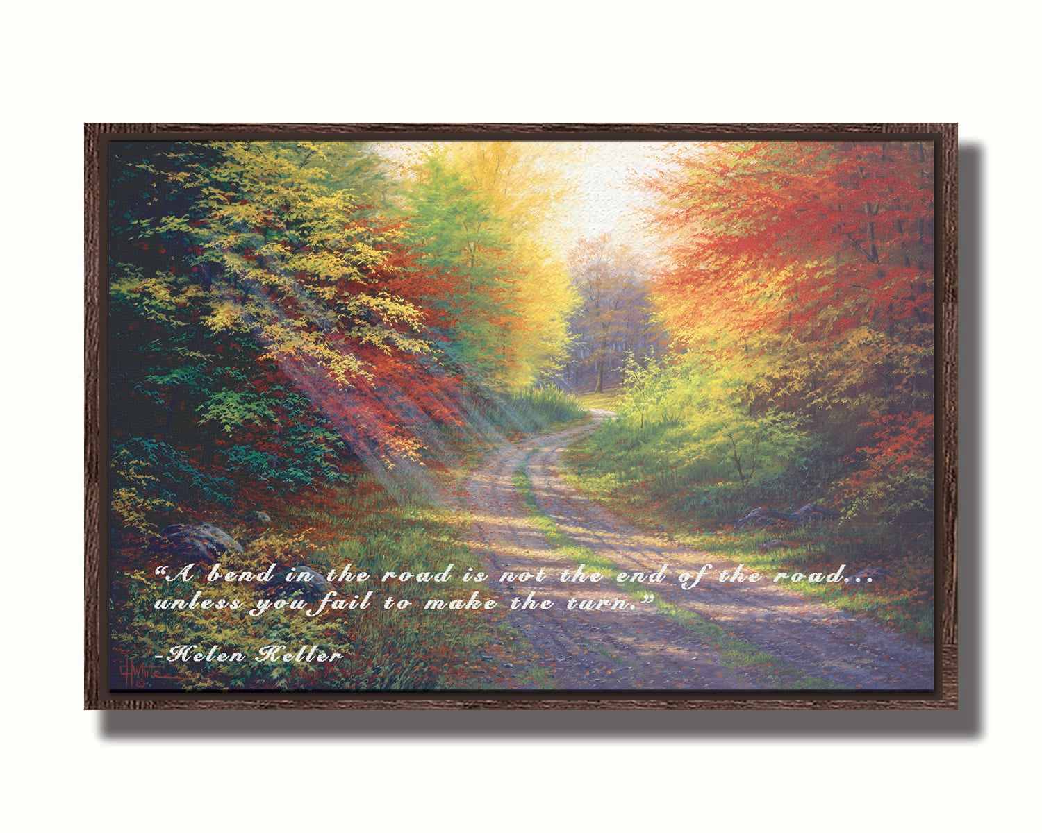 A landscape painting of a gravel road winding thorugh an autumn forest with a mix of vibrant red, yellow, and green leaves. The Helen Keller quote "A bend in the road is not the end of the road... unless you fail to make the turn" is overlaid in white across the bottom. Printed on canvas in a float frame.