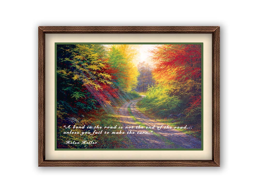 A landscape painting of a gravel road winding thorugh an autumn forest with a mix of vibrant red, yellow, and green leaves. The Helen Keller quote "A bend in the road is not the end of the road... unless you fail to make the turn" is overlaid in white across the bottom. Printed on paper, matted, and framed.