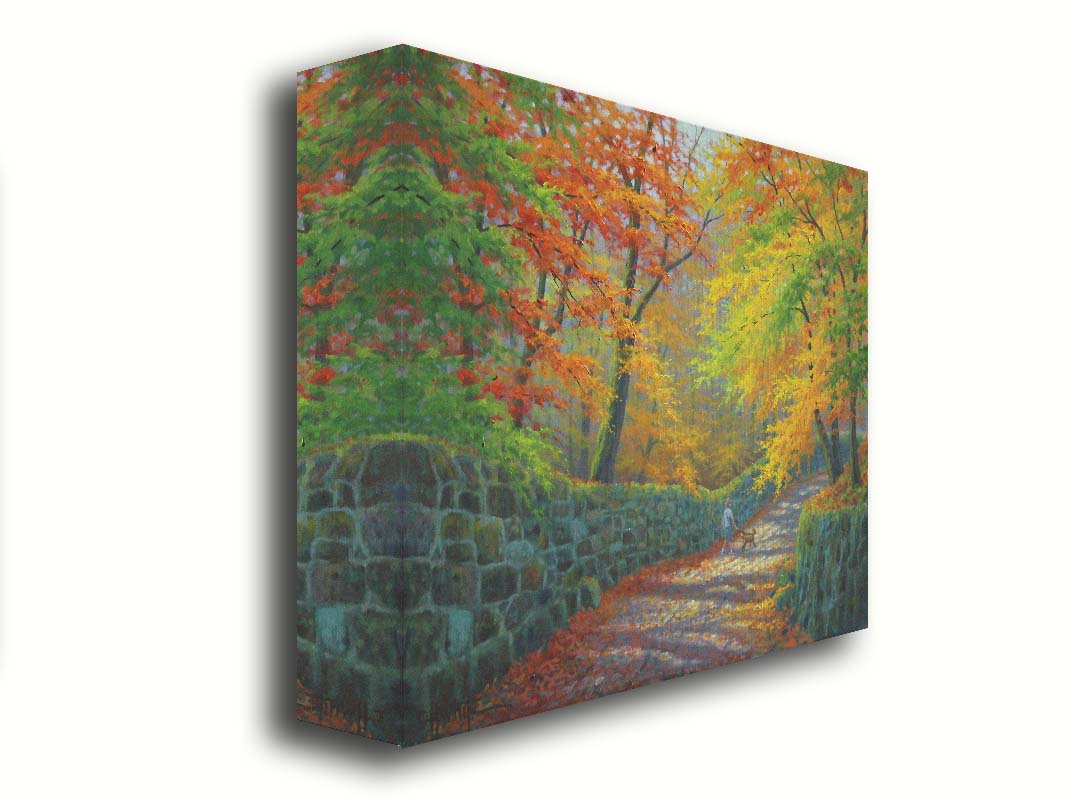 A painting of a stone road through a forest. It is bordered by stone walls on either side. The leaves of the trees are changing colors and dropping to the ground for fall. A person can be seen walking a leashed down further down the path. Printed on canvas.