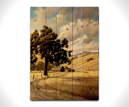 A painting of a grassy field over deep hills. A haphazard fence runs along a dirt road thorugh the field. Red barns can be seen in the distance alongside grazing cows. Printed on a wood pallet.