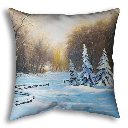 Throw pillow with a winter landscape design featuring trees and snow.