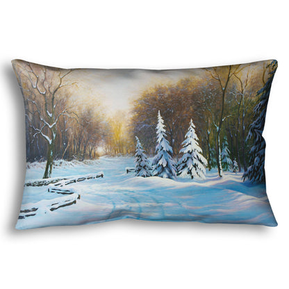 Throw pillow with a winter landscape design featuring trees and snow.