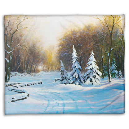 Fleece blanket with a winter landscape design featuring trees and snow.