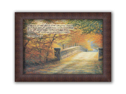 A painting looking down a bridge road during fall. The trees lining the road have turned yellow and orange for autumn, and some of their fallen leaves are scatted along the path. It is overlayed in the upper left with Proverbs 3:5-6 of the Bible, reading "5. Trust in the Lord with all your heart and lean not on your own understanding; 6. In all your ways acknowledge him, and he will make your paths straight." Printed on canvas and framed.