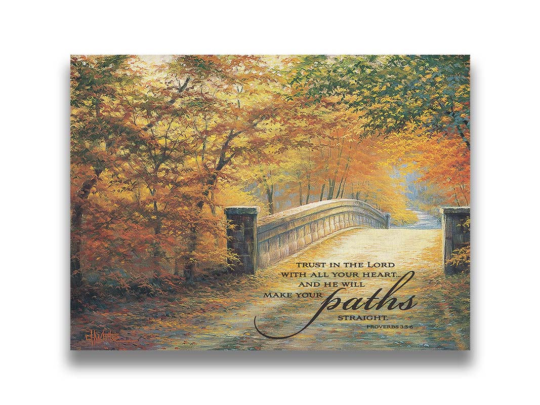 A painting looking down a bridge road during fall. The trees lining the road have turned yellow and orange for autumn, and some of their fallen leaves are scatted along the path. It is overlayed in the bottom right with an excerpt of Proverbs 3:5-6 of the Bible, reading "Trust in the Lord with all your heart... and he will make your paths straight." Printed on canvas.