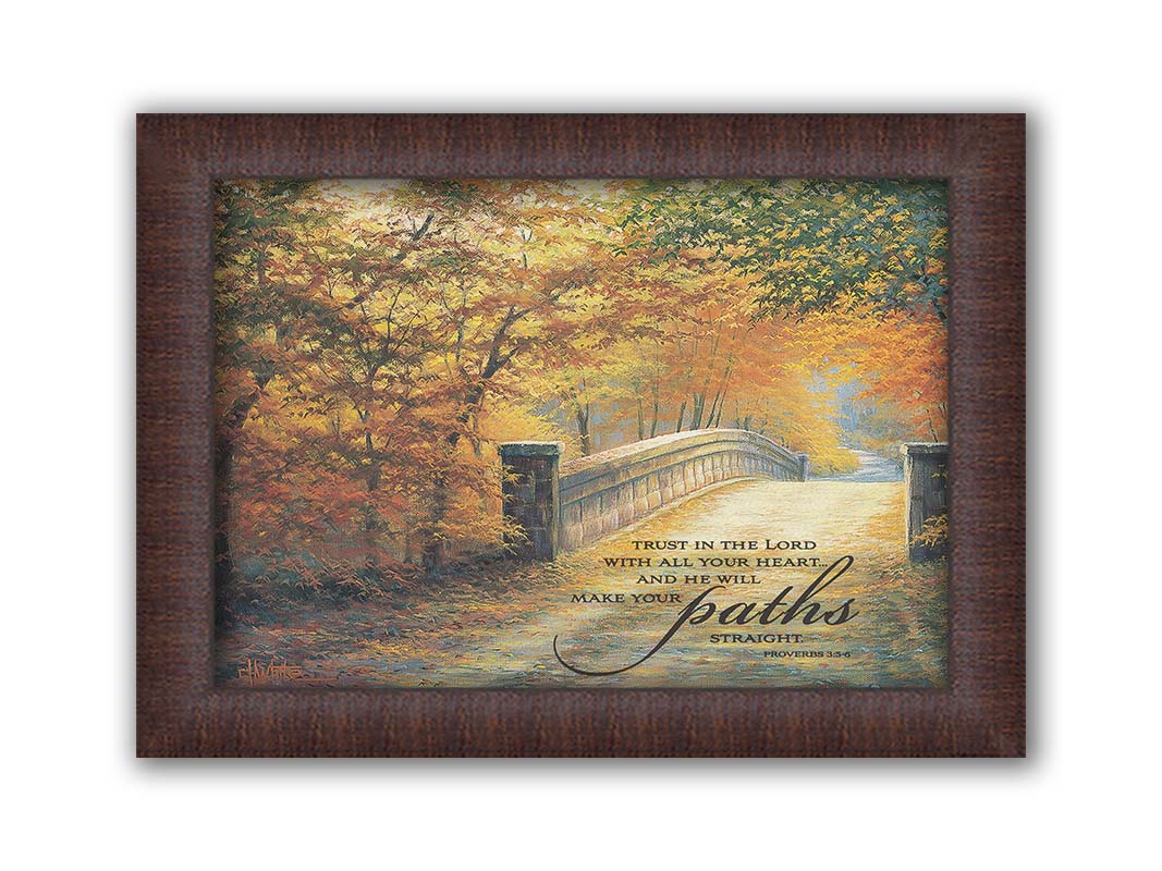 A painting looking down a bridge road during fall. The trees lining the road have turned yellow and orange for autumn, and some of their fallen leaves are scatted along the path. It is overlayed in the bottom right with an excerpt of Proverbs 3:5-6 of the Bible, reading "Trust in the Lord with all your heart... and he will make your paths straight." Printed on canvas and framed.