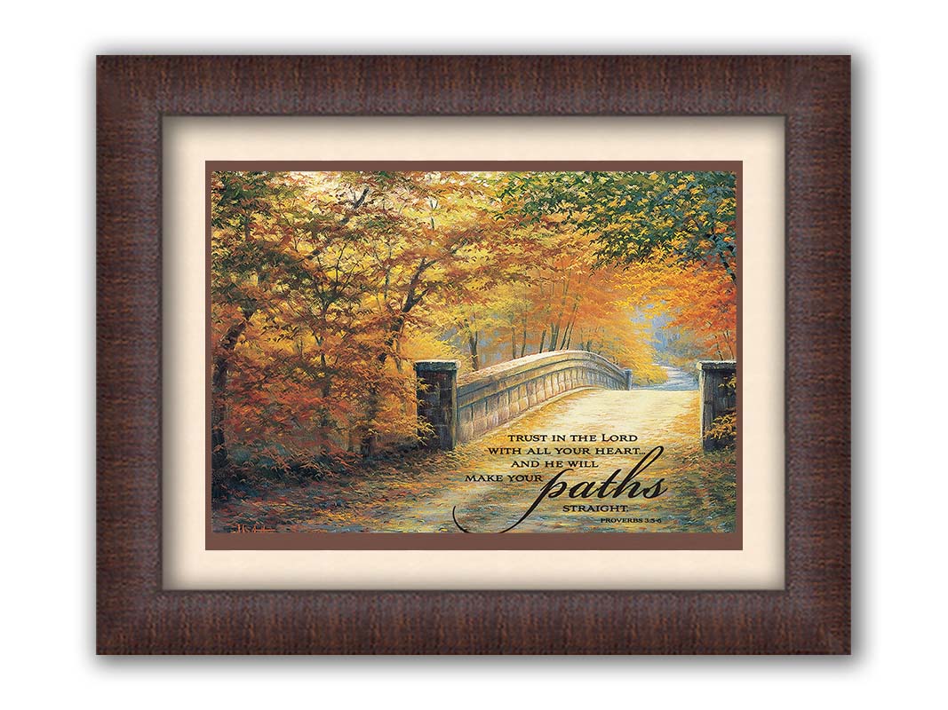 A painting looking down a bridge road during fall. The trees lining the road have turned yellow and orange for autumn, and some of their fallen leaves are scatted along the path. It is overlayed in the bottom right with an excerpt of Proverbs 3:5-6 of the Bible, reading "Trust in the Lord with all your heart... and he will make your paths straight." Printed on paper, matted, and framed.