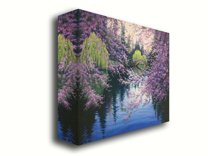 A painting of Beacon Hill Park in Victoria, British Columbia, Canada, during the springtime cherry blossom season. Pink blossoms over Goodacre Lake frame a stone bridge in the background. Printed on canvas.