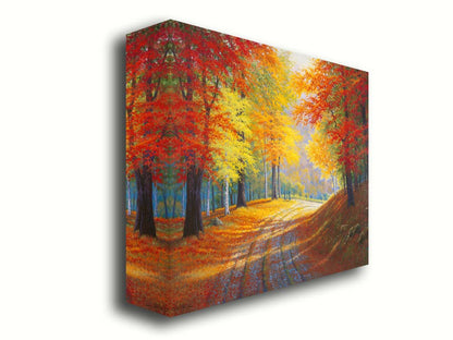 A painting of a gravel road through a forest in autumn. Orange red, and yellow leaves coat the ground and cover the trees, highlighted by bright sunlight. Printed on canvas.