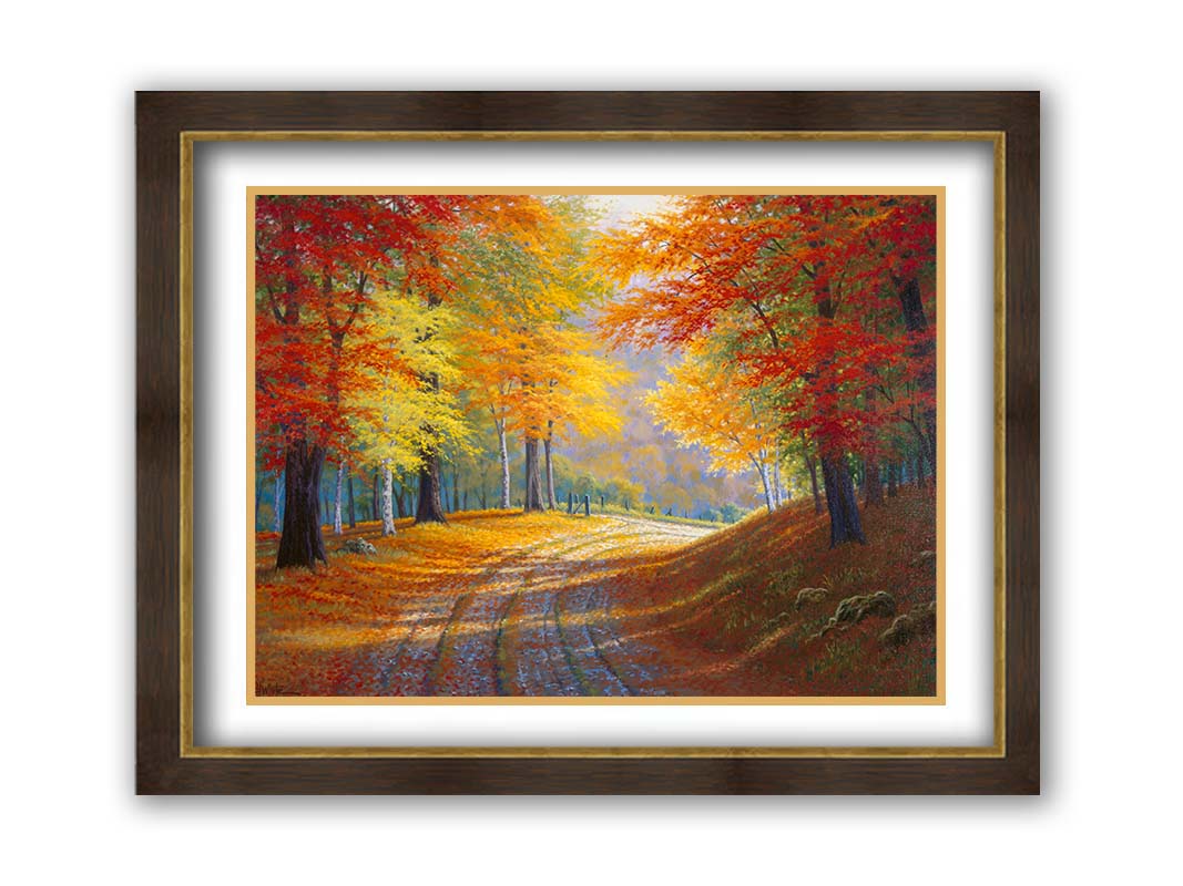 A painting of a gravel road through a forest in autumn. Orange red, and yellow leaves coat the ground and cover the trees, highlighted by bright sunlight. Printed on paper, matted, and framed.