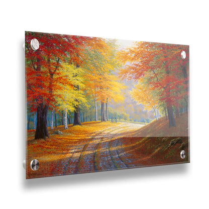 A painting of a gravel road through a forest in autumn. Orange red, and yellow leaves coat the ground and cover the trees, highlighted by bright sunlight. Printed on acrylic.