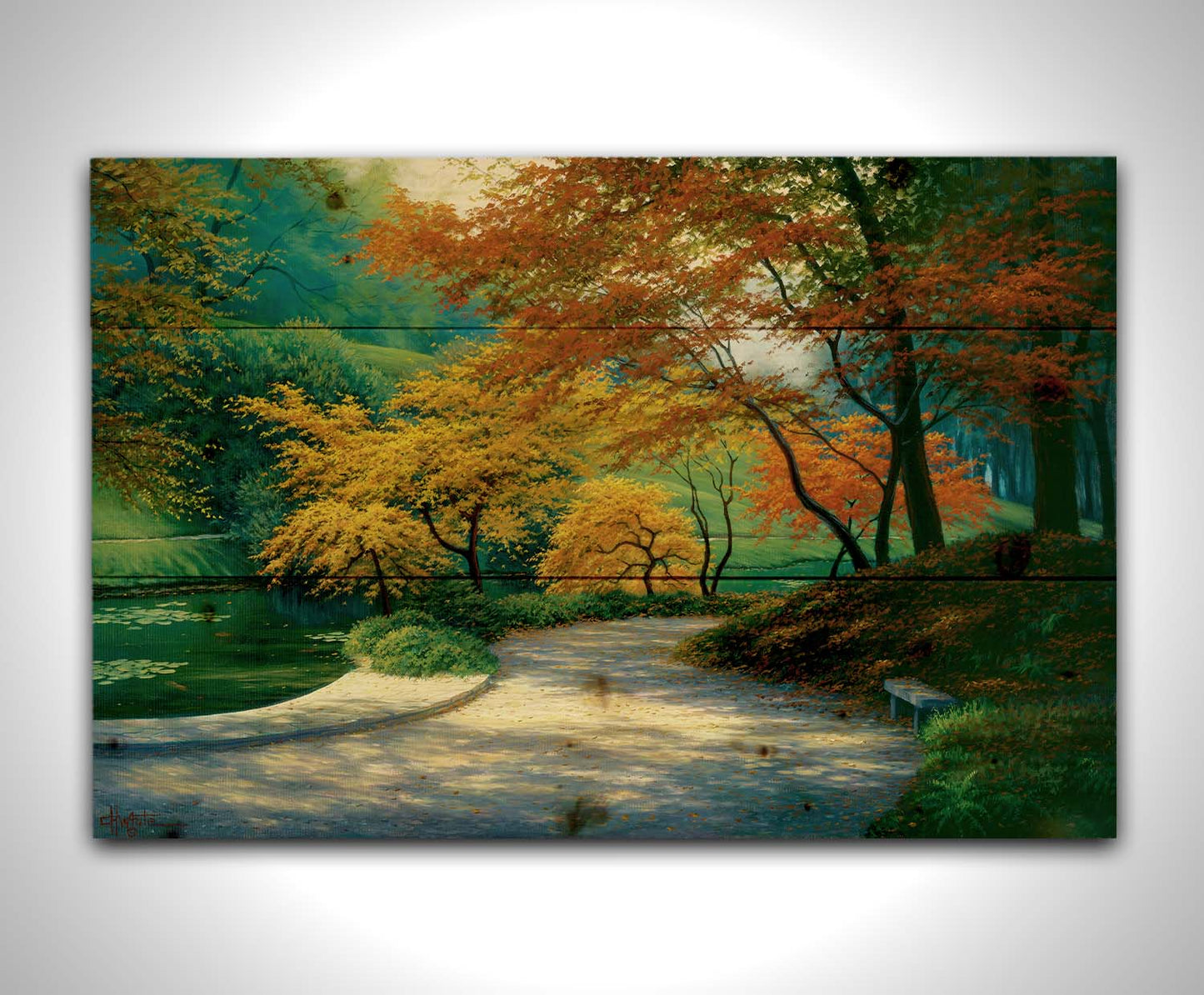 A painting of a paved garden path beside a pond, bordered by orange and yellow fall trees. Printed on a wood pallet.