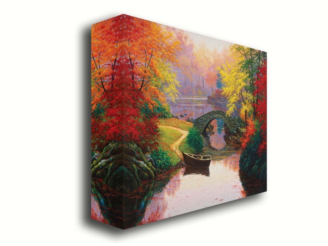 A painting of an idyllic fall scene, with colorful maples surrounding a river crossed by a small stone bridge. A rowboat is tied down near the bridge. Printed on canvas.