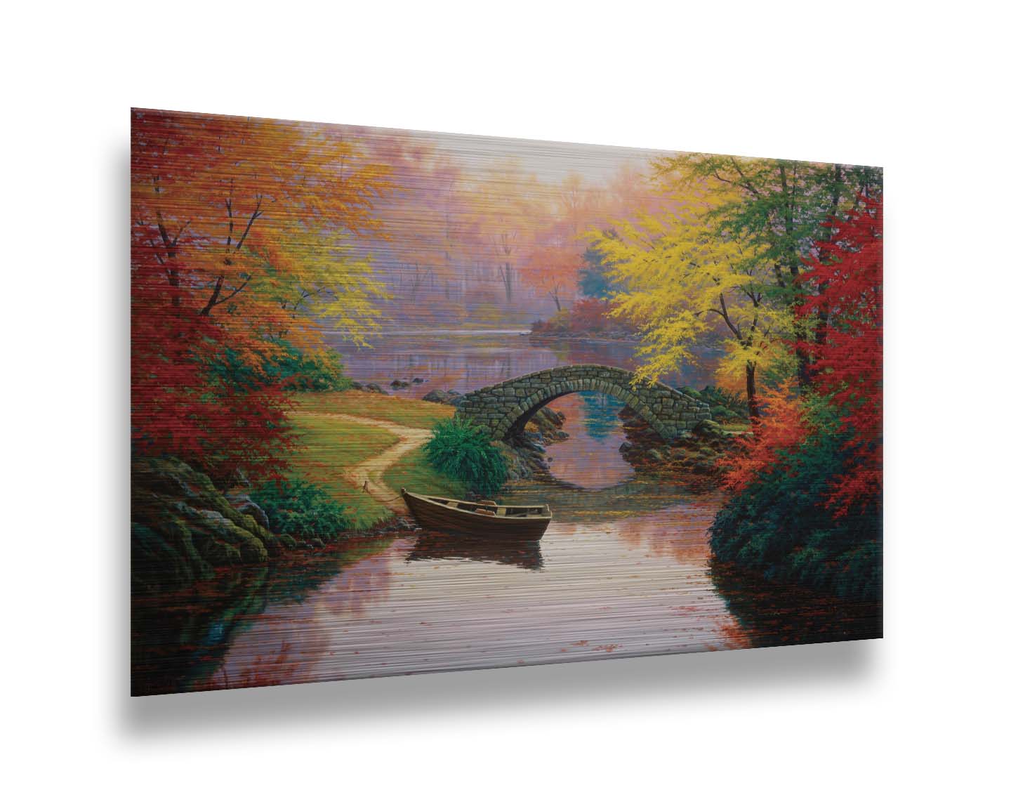 A painting of an idyllic fall scene, with colorful maples surrounding a river crossed by a small stone bridge. A rowboat is tied down near the bridge. Printed on metal.