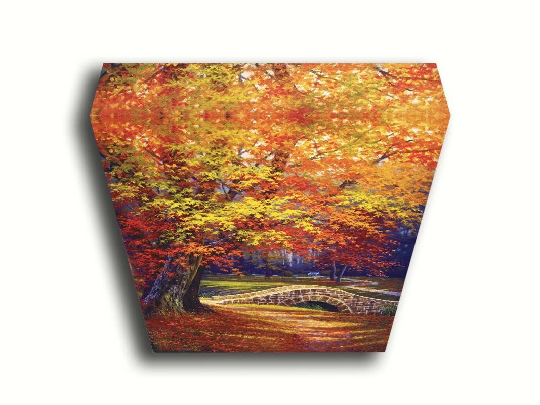 A painting of an autumn park, with the colorful trees dropping orange leaves onto the path below. A stone bridge crosses a small stream. Printed on canvas.