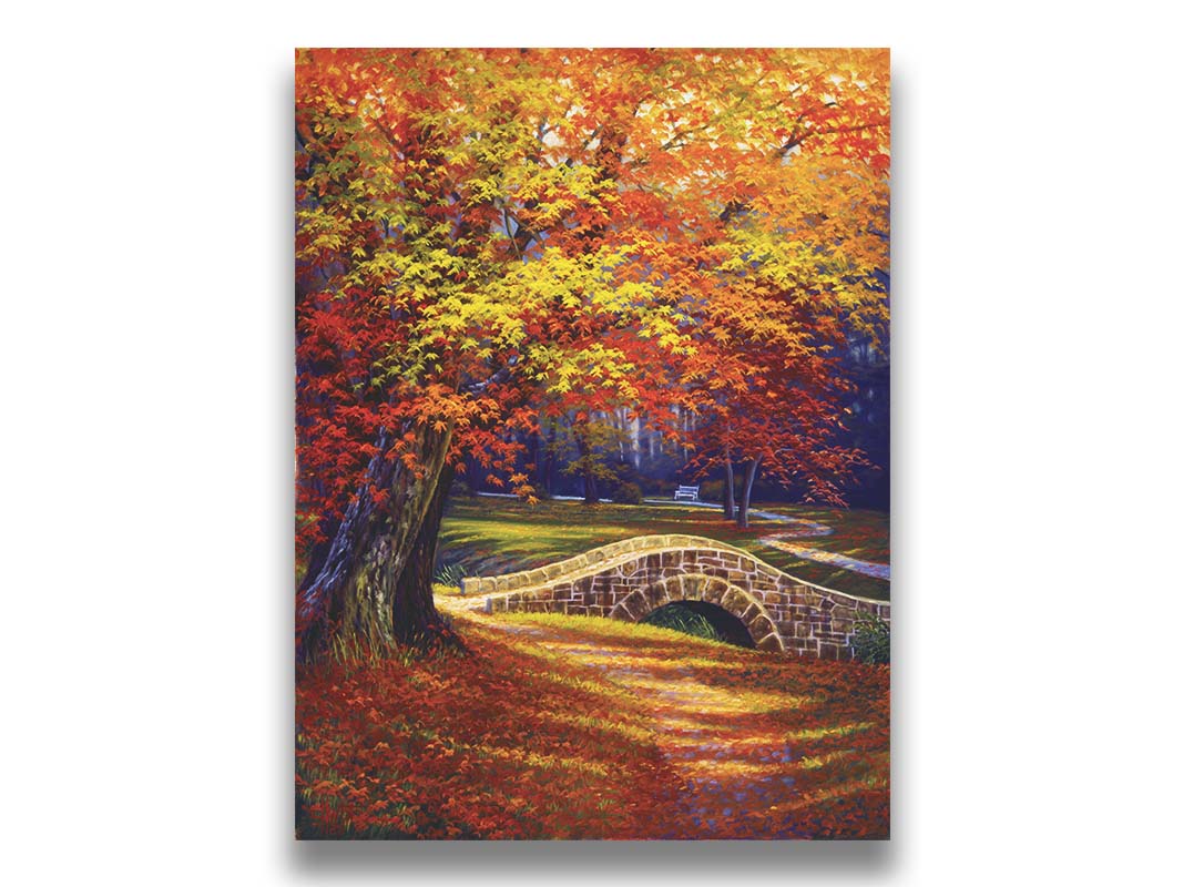 A painting of an autumn park, with the colorful trees dropping orange leaves onto the path below. A stone bridge crosses a small stream. Printed on canvas.