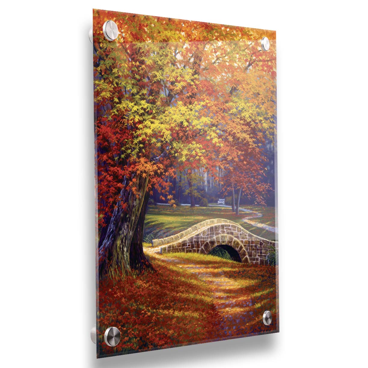 A painting of an autumn park, with the colorful trees dropping orange leaves onto the path below. A stone bridge crosses a small stream. Printed on acrylic.