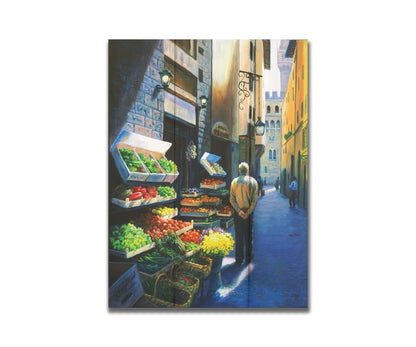 A painting of a Florence, Italy, street lined with produce stands. People stroll down the street. Printed on a box board.