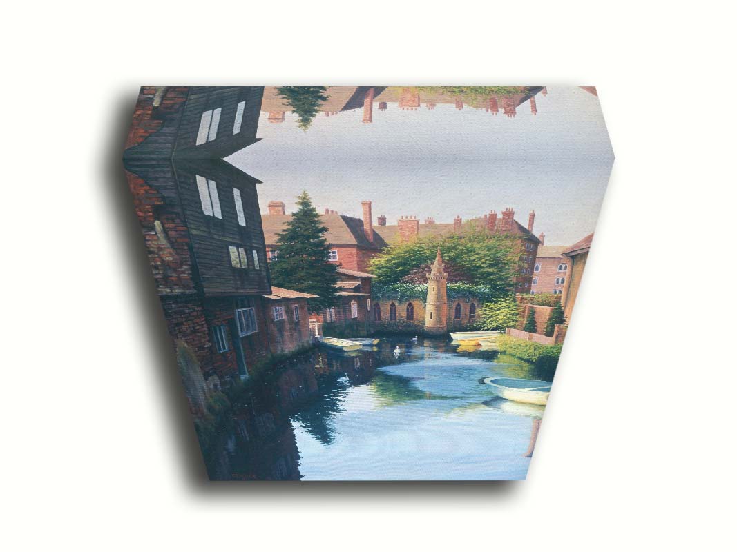 A painting of a canal in Canterbury in Kent, England. A few small row boats are docked along the waterway between historic red brick buildings. Printed on canvas.