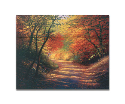 A painting of a path through the woods in autumn, with orange leaves falling onto the road. Printed on a box board.