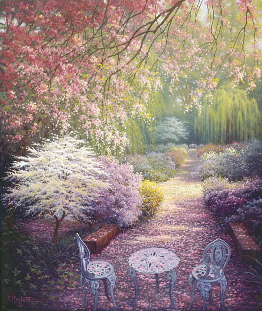 A painting of a springtime garden, with cherry blossom petals coating the garden and pathways. White chairs, a table, and a bench decorate the garden full of red, pink, and white flowers. 