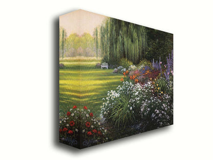 A painting of a garden filled with vibrant flowers, including lilies, carnations, poppies, and lavender. A serene white bench also sits under a weeping willow tree. Printed on canvas.