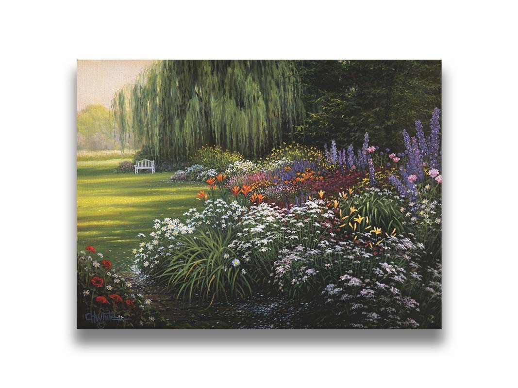 A painting of a garden filled with vibrant flowers, including lilies, carnations, poppies, and lavender. A serene white bench also sits under a weeping willow tree. Printed on canvas.