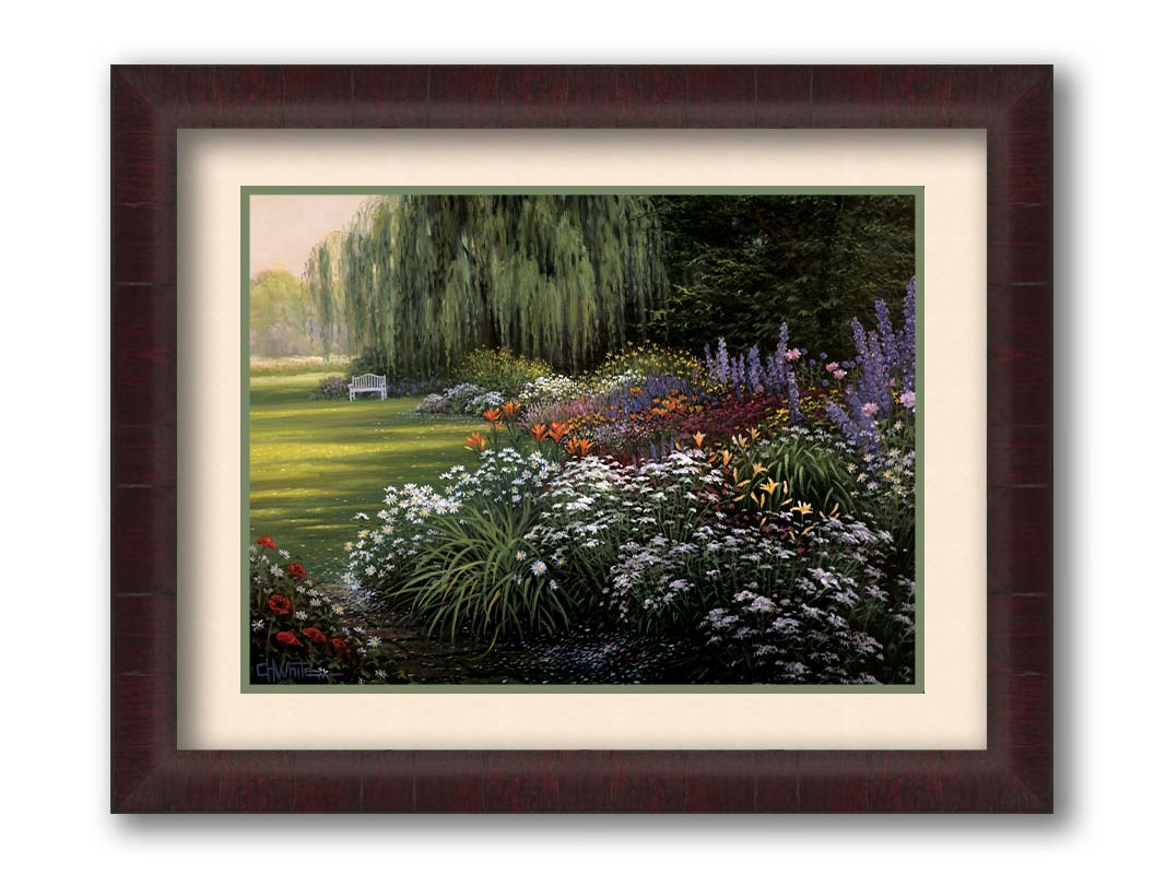 A painting of a garden filled with vibrant flowers, including lilies, carnations, poppies, and lavender. A serene white bench also sits under a weeping willow tree. Printed on paper, matted, and framed.