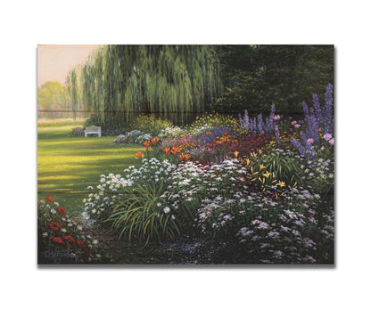 A painting of a garden filled with vibrant flowers, including lilies, carnations, poppies, and lavender. A serene white bench also sits under a weeping willow tree. Printed on a box board.