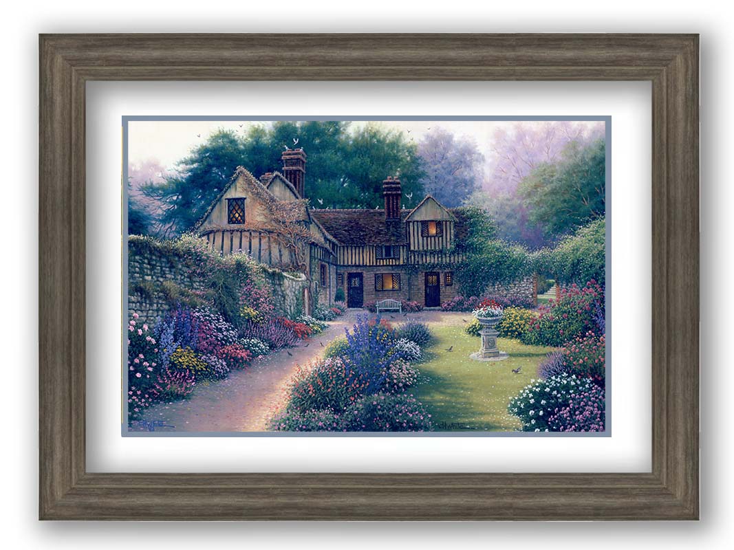 A painting of a cozy brown house surrounded by a vibrant and diverse display of flowers, including pink roses and lavender. Little birds search for seeds within the enchanting garden scene. Printed on paper, matted, and framed.