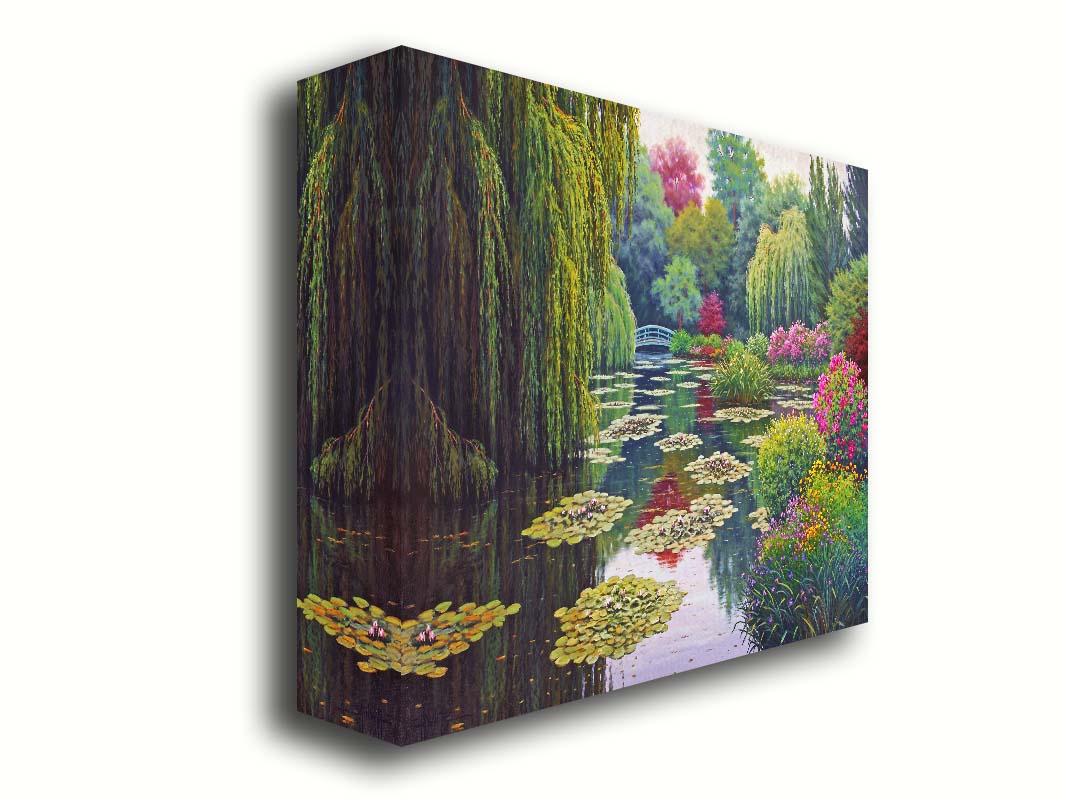 A painting of Claude Monet's garden at his home in Giverny, France. A pond dotted with lily pads is surrounded by weeping willows and colorful flower bushes in pinks, reds, yellows, and purples. Printed on canvas.