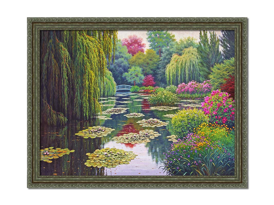 A painting of Claude Monet's garden at his home in Giverny, France. A pond dotted with lily pads is surrounded by weeping willows and colorful flower bushes in pinks, reds, yellows, and purples. Printed on canvas and framed.