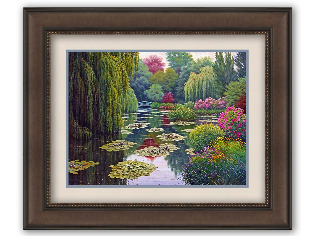 A painting of Claude Monet's garden at his home in Giverny, France. A pond dotted with lily pads is surrounded by weeping willows and colorful flower bushes in pinks, reds, yellows, and purples. Printed on paper, matted, and framed.