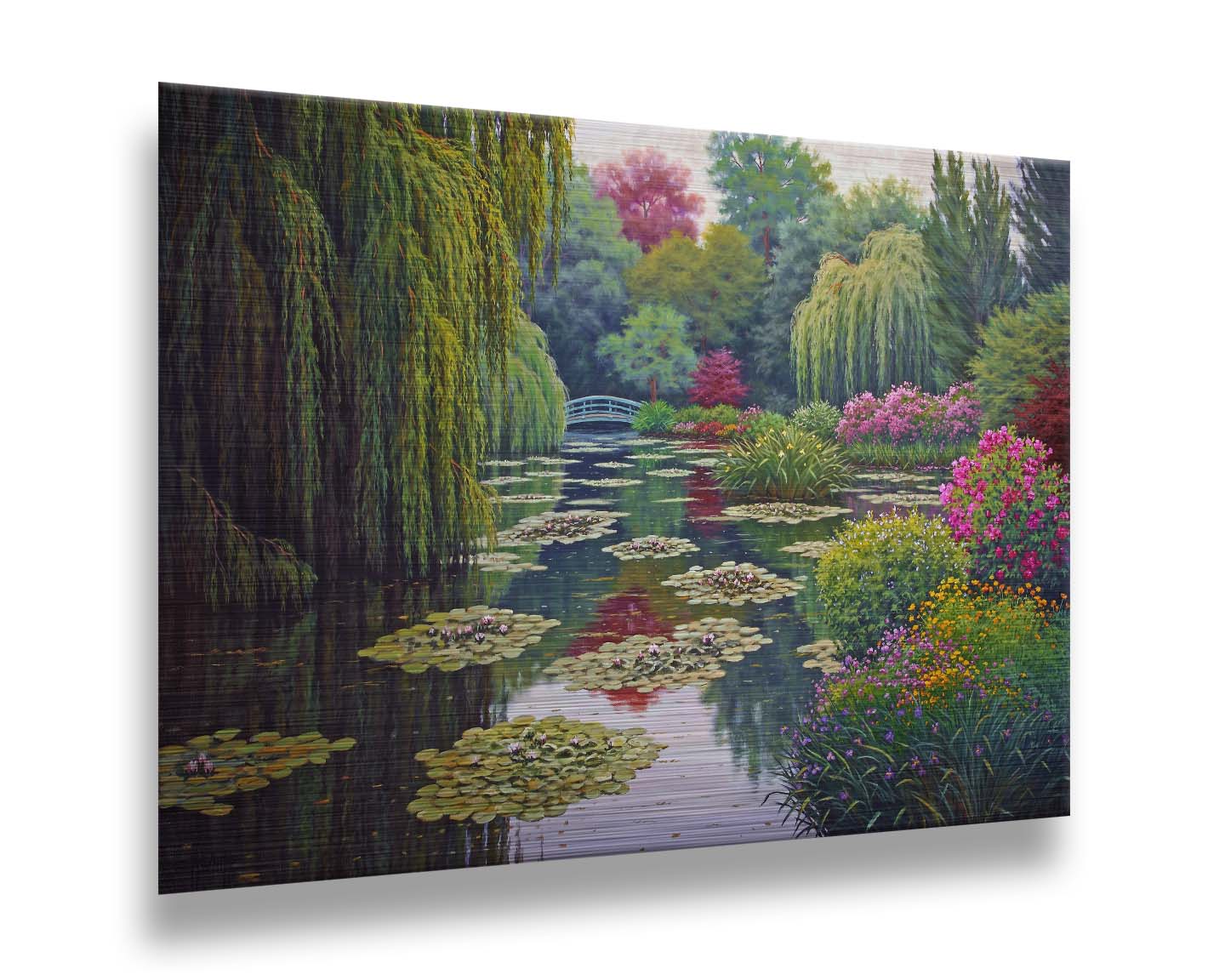 A painting of Claude Monet's garden at his home in Giverny, France. A pond dotted with lily pads is surrounded by weeping willows and colorful flower bushes in pinks, reds, yellows, and purples. Printed on metal.