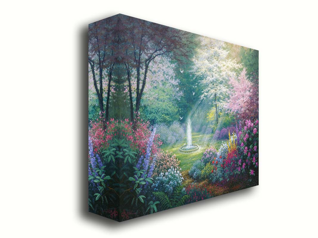 A painting of a garden filled with a variety of flowers, including lavender and poppies, alongside blooming pink and white trees. A fountain is at the garden's center, lit by beams of light from between the trees. Doves fly through the scene. Printed on canvas.