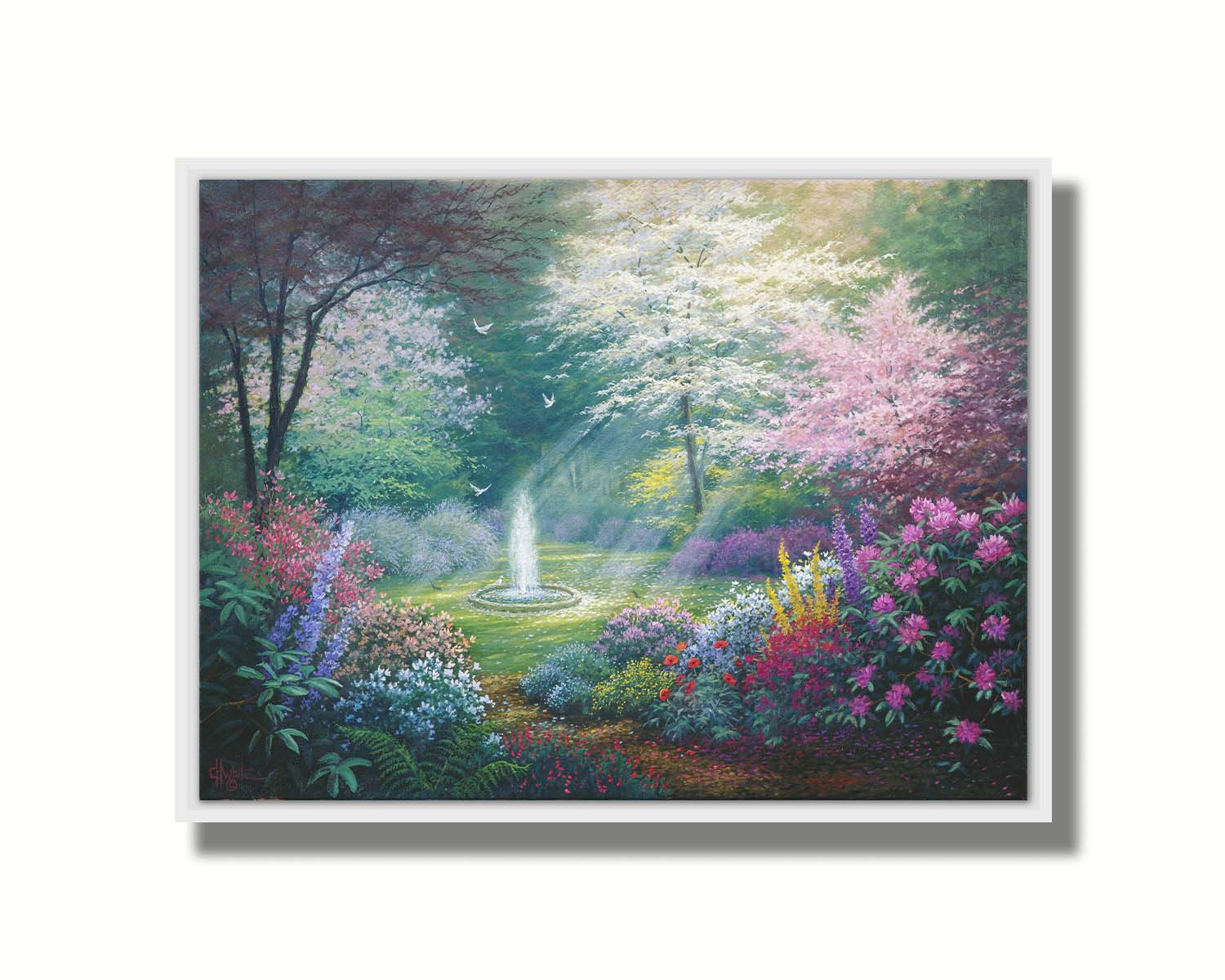 A painting of a garden filled with a variety of flowers, including lavender and poppies, alongside blooming pink and white trees. A fountain is at the garden's center, lit by beams of light from between the trees. Doves fly through the scene. Printed on canvas in a float frame.