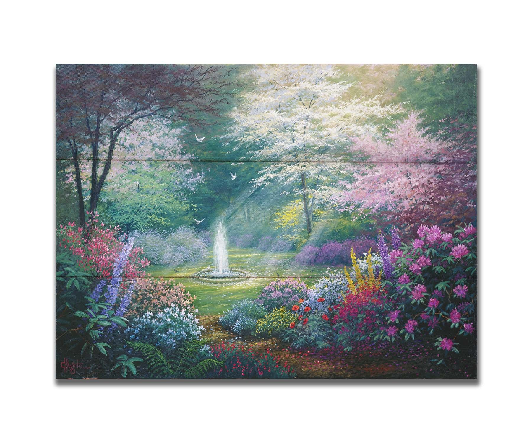 A painting of a garden filled with a variety of flowers, including lavender and poppies, alongside blooming pink and white trees. A fountain is at the garden's center, lit by beams of light from between the trees. Doves fly through the scene. Printed on a box board.