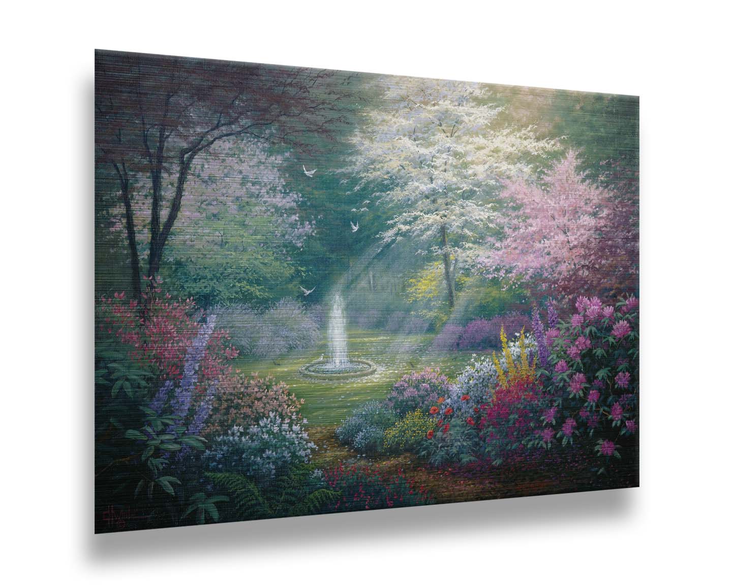 A painting of a garden filled with a variety of flowers, including lavender and poppies, alongside blooming pink and white trees. A fountain is at the garden's center, lit by beams of light from between the trees. Doves fly through the scene. Printed on metal.