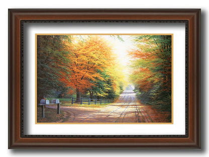 A painting of a gravel road, leading past a driveway with mailboxes and a quaint fence. All sides of the road are lined with trees, many of whose leaves have turned yellow and orange for fall. Printed on paper, matted, and framed.