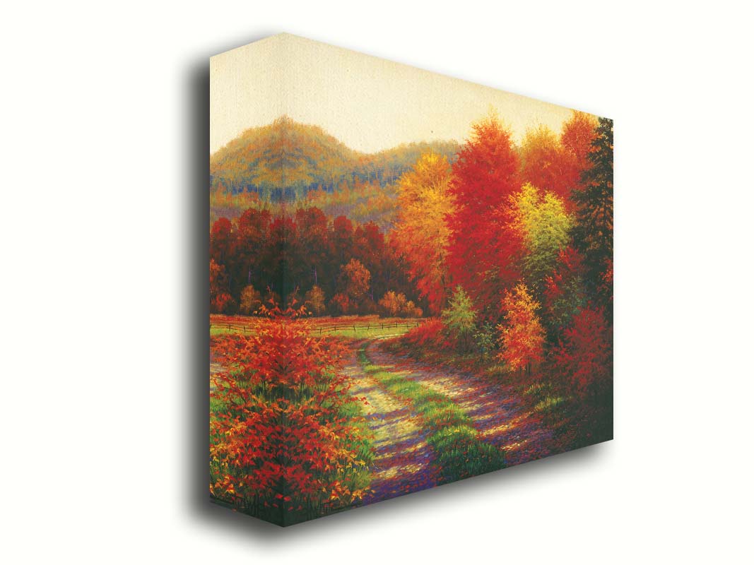 A painting of a forest in autumn, cut through by a gravel road curving into the distant fields and hills. Printed on canvas.