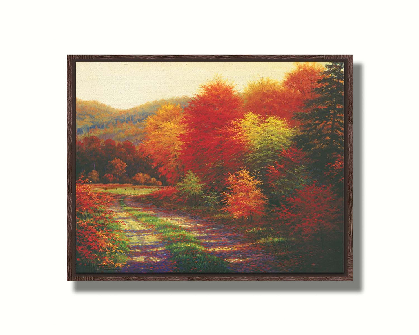 A painting of a forest in autumn, cut through by a gravel road curving into the distant fields and hills. Printed on canvas in a float frame.